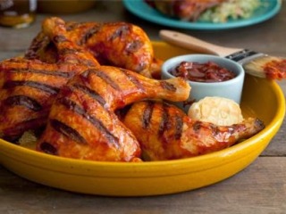 Barbecue chicken in yellow bowl.